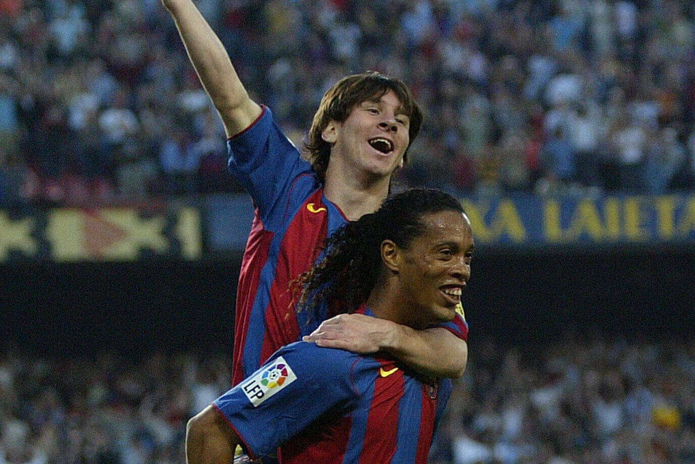 Messi celebrating on Ronaldinho's shoulders at Camp Nou